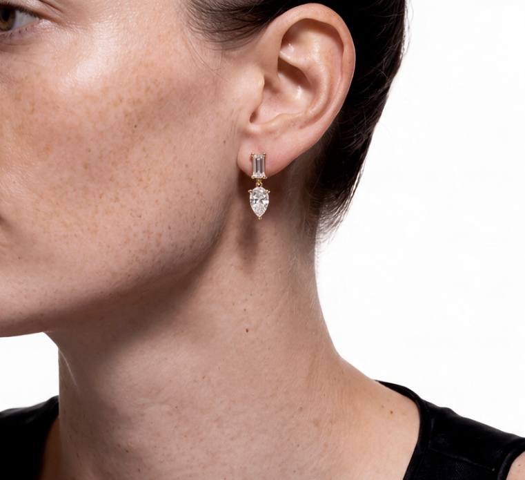 Diamond drop earring in yellow gold, worn
